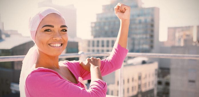 Black woman honoring Metastatic Breast Cancer Awareness Day